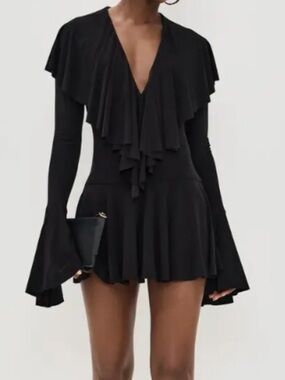Norma Kamali Worn once to a concert. EUC Built in panties. Flower is not include